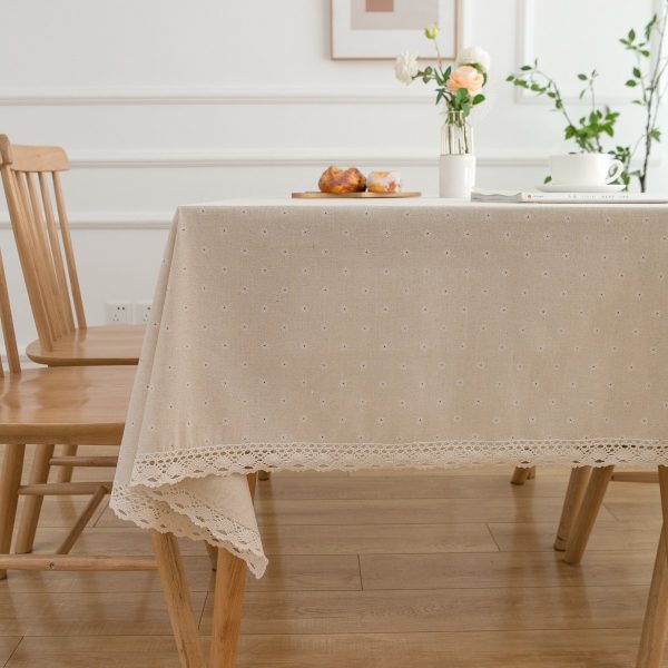 Rustic kitchen dining table with vintage floral cotton tablecloth and daisy design