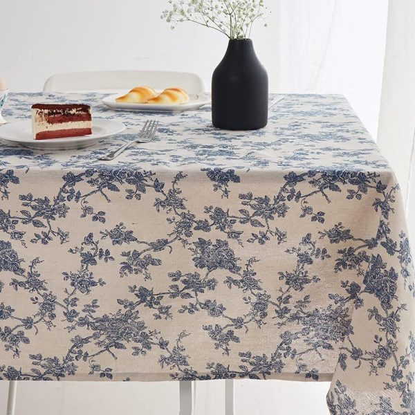 Garden brunch scene with vintage floral cotton table cover and rustic decor