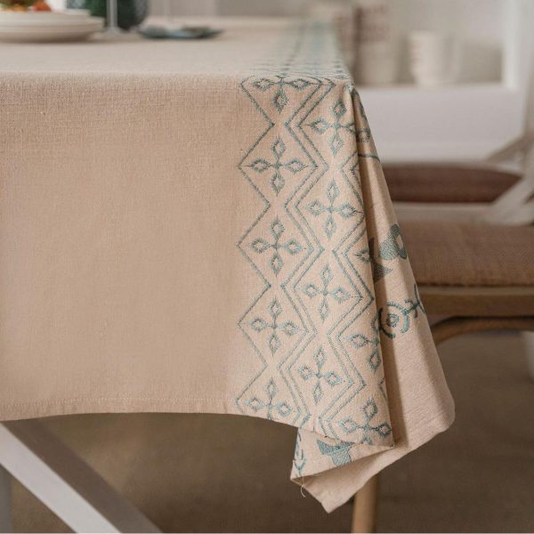 Rustic dining setup featuring vintage-inspired table topper
