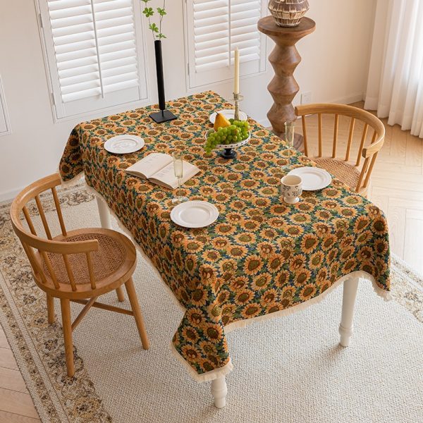 Sunflower vintage table linens with tassel edge on wooden dining table