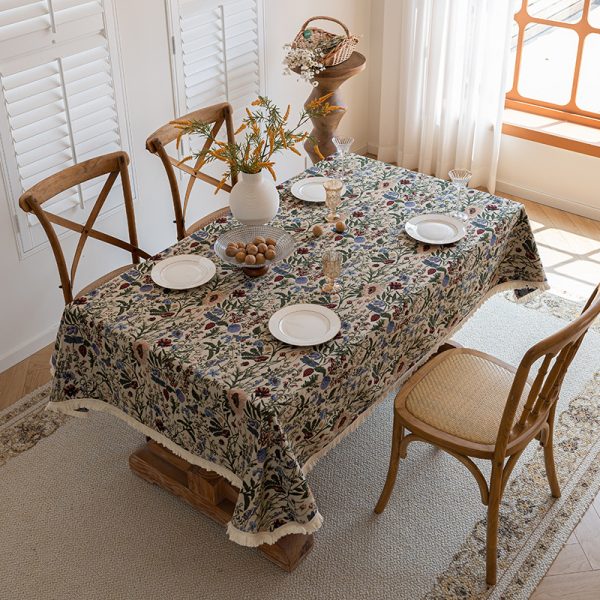 Reusable vintage floral tablecloth with lace edges, styled for farmhouse dining